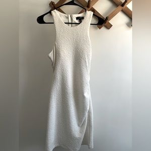 White sparkling dress. Open back. Above knee. Very comfortable.